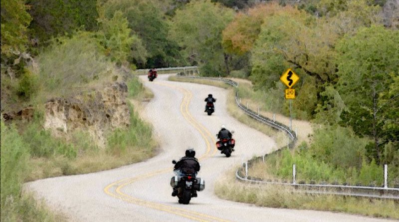 motorcycles on twisting road